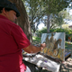 Artist Jerrel Sustaita works on his painting of the Robert E. Lee statue at Robert E. Lee Park in Dallas on Thursday. He said, “I might not be able to do it tomorrow.” (Jae S. Lee/Dallas Morning News)